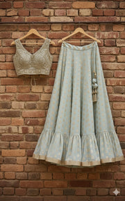 Pastel Mint Ruffle Hem Lehenga Choli With Regal Gold Blouse